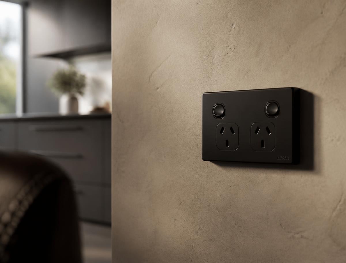 New black double power point installed on a plastered interior wall